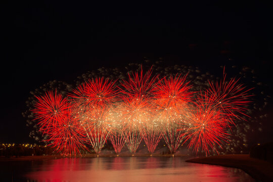 Fireworks Reflecting On A Lake; Calgary, Alberta, Canada