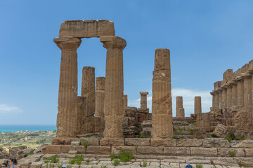 Fototapeta na wymiar View and details of the Valley of the Temples in Agrigento, Sicily. A monumental complex preserved in excellent condition of the works of ancient Greece. Timeless beauty, striking, family holidays.