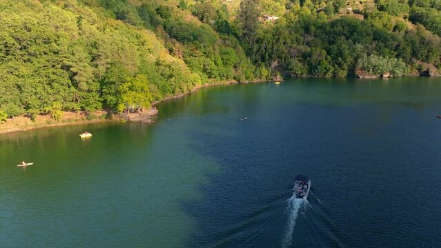 Sailing On Serene River Of Minho Near Belesar Village In Ribeira Sacra, Galicia Spain. Aerial Drone Shot