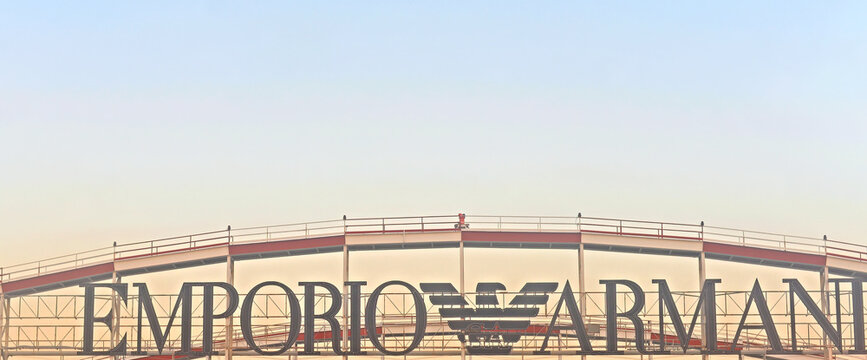 MILAN, ITALY &ndash; SEPTEMBER 29, 2023: Advertisement on top of the Linate airport building for Emporio Armani, part of Giorgio Armani SPA, an Italian brand of luxurious clothing, shoes and accessories