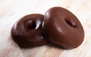 Appetizing chocolate-coated donut closeup. High quality photo