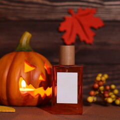 Glass perfume bottle with pumkin face, halloween aroma