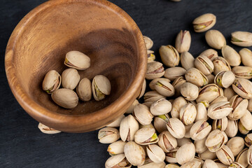 a large number of salty and crispy pistachios close-up