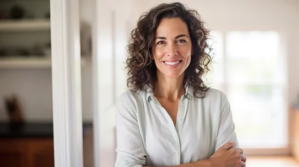 Tuinposter A portrait of a beautiful Hispanic looking woman wearing white shirt in her house, office, housewife, working from home, lifestyle blog © Happy Stock