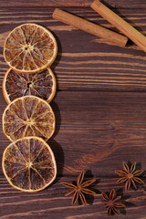 Fototapeta na wymiar Christmas decoration, orange cinnamon anise on wooden background