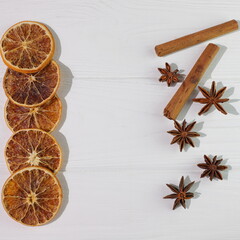 Orange Cinnamon Anise on white wooden background, christmas decoration