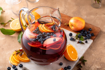 Winter orange and berry sangria with sliced oranges and blueberries