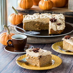 Slices of pumpkin spice latte cake with espresso frosting, ready for eating.
