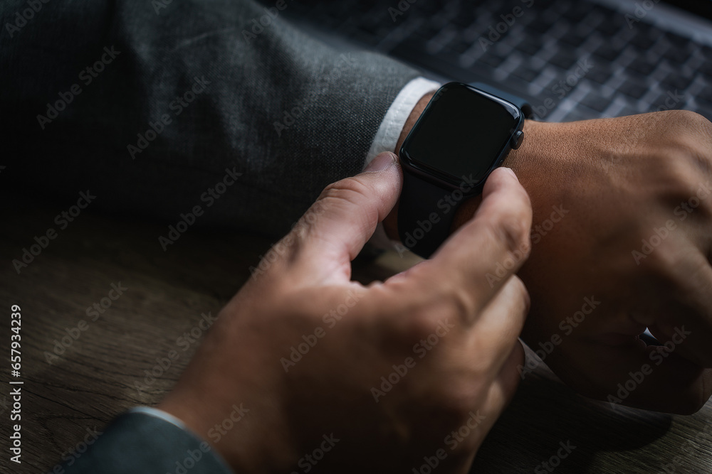 Poster man checking time on his smartwatch device close-up display clock checking lifestyle communication p