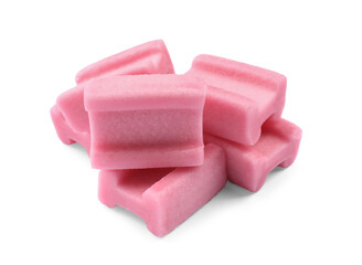 Many tasty pink chewing gums on white background
