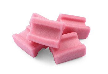 Many tasty pink chewing gums on white background