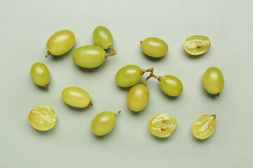 Fresh green grapes on color background