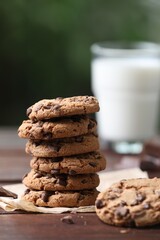 Delicious chocolate chip cookies on wooden table, closeup