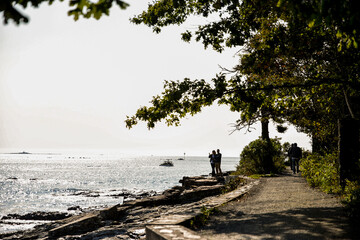 Silhouettes of People along Bar Harbor Coastline in Maine