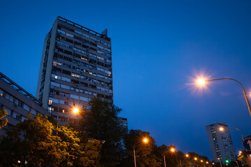 Selective blur on a High rise building from Novi Beograd, in Zemun, Belgrade, Serbia at night, a traditional communist housing ensemble with a brutalist style. - obrazy, fototapety, plakaty
