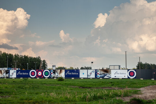 RIGA, LATVIA - AUGUST 19, 2023: Logo of Rail Baltica on their construction site in Riga Airport. Rail Baltica is a railway project to link Baltic countries by high speed rail by 2030.
