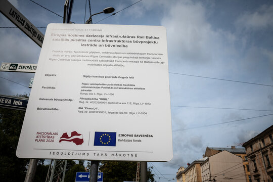 RIGA, LATVIA - AUGUST 19, 2023: Sign promoting a the rail baltica high speed train project funded by the European Union in Latvia. The EU is one of the main funding donor in Baltic countries.