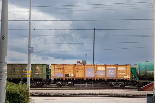 JELGAVA, LATVIA - AUGUST 20, 2023: Open Wagons, also called Gondola wagons on a yard of latvian railways in jelgava, belonging to KZH, the cargo division of Kazakh railways, used for exporting goods.