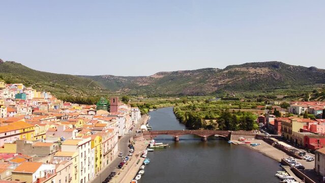 Bosa establishing view of river Temo, colorful houses buildings, Sardinia, day