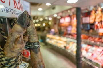 Pork leg hanging in butcher shop in Madrid, Spain