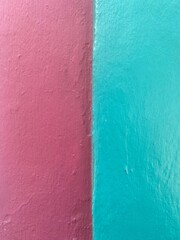 Bright colored textured painted wall in Oaxaca, Mexico