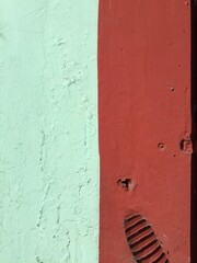 Bright colored textured painted wall in Oaxaca, Mexico