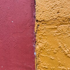 Fototapeta premium Bright colored painted textured walls in Oaxaca Mexico
