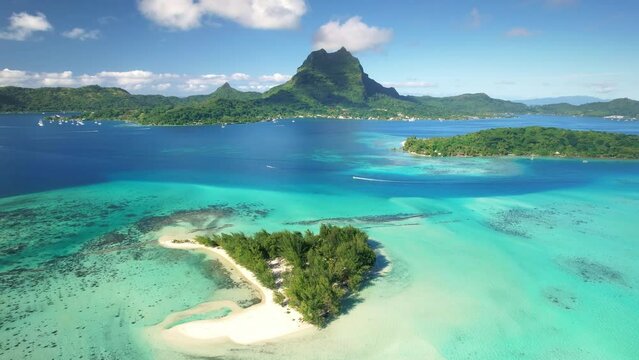 Bora Bora drone aerial view, clear water lagoon. Tahiti island. French Polynesia. Exotic travel vacation getaway, romantic honeymoon destination.