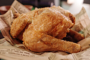 Close up detail of Grilled whole chicken meat on paper. 