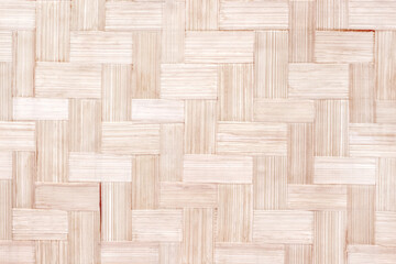 Woven bamboo wood mat texture light brown background