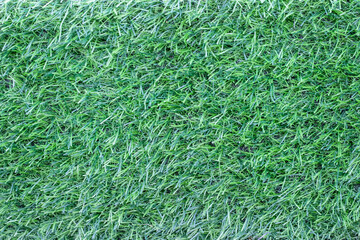 Artificial green grass field flooring texture top view summer background