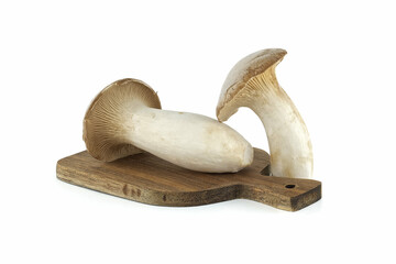 Eryngi mushroom on cutting board over white