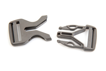 Fastex plastic clip for backpacks, bags, nylon belts on a white background. items and accessories for clothing and fixing tourist equipment