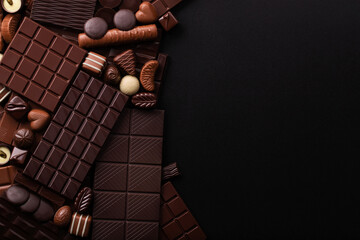 pile chocolate bars and candies background, sweet confection for dessert.