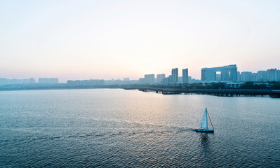 Sailboat in the sea at sunset