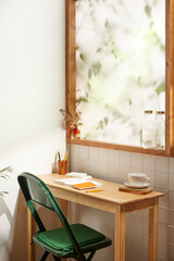 A comfortable room where warm afternoon sunlight
comes in through a window with a view of tree leaves