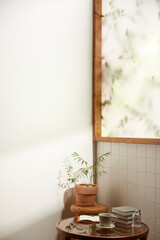 A comfortable room where warm afternoon sunlight
comes in through a window with a view of tree leaves