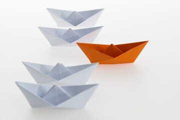 The orange origami boat is the winner