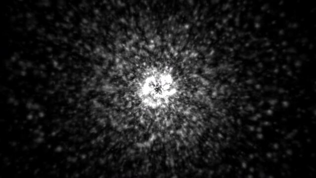 Particles exploding from central point then expanding as more particles are born.