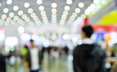 Large group of people walking in exhibition hall - obrazy, fototapety, plakaty