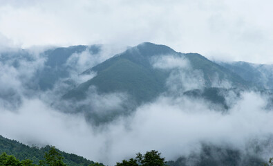 Landscape of mountain covered with fog