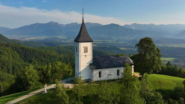 Aerial view of St. Primoz Church, Jamnik, Slovenia, summer morning light