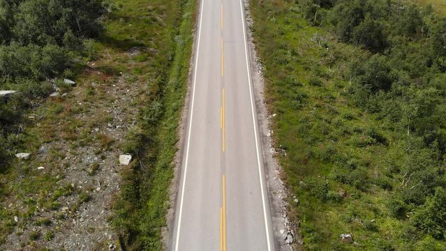 A Car Passing On Setesdal Road In Vestfold og Telemark County, Norway. Aerial Topdown