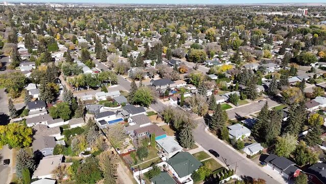 Elevate your view over Adelaide Churchill, a historic neighborhood in Saskatoon, Saskatchewan. This aerial drone footage unveils tree-lined streets, character homes, and communal parks