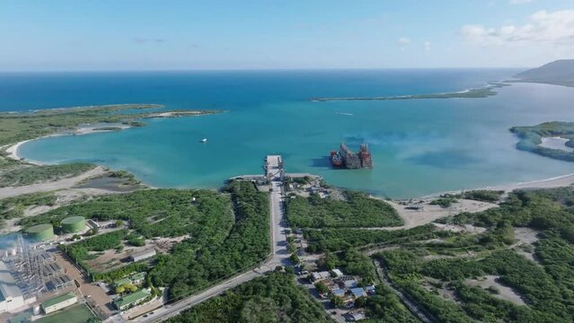 Floating power plant of MV Karadeniz Powership Irem Sultan, Azua in Dominican Republic. Aerial drone panoramic view and space for copy