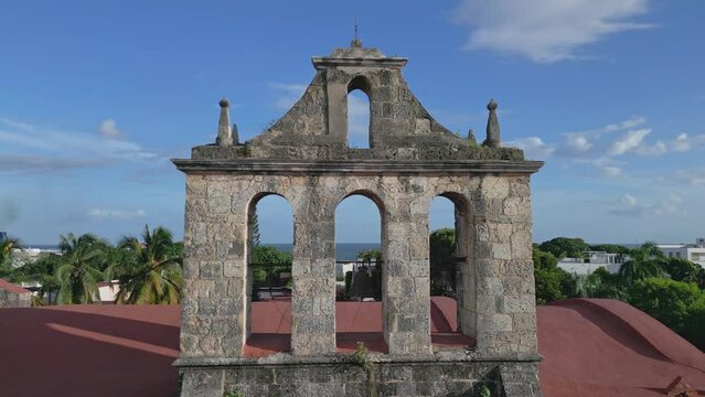 Bell tower on top of Dominican Church and Convent in Colonial City, Santo Domingo in Dominican Republic. Aerial drone view