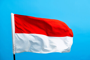 Indonesia flag waving on blue background