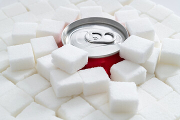 Cola can in pile of sugar cubes