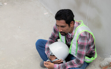 Stressed Asian foreman employee middle-aged man worried about compensation or unemployment,...
