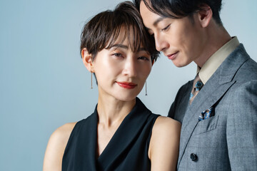 Japanese couple spending time together indoors - obrazy, fototapety, plakaty